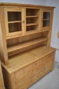A modern golden oak dresser, approx dimensions W150 D56 H187cm
