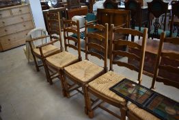 A set of eight (six plus two) ladderback dining chairs having rush seats