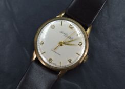 A gent's 1960's 9ct gold Tho Russell & Son manual wrist watch having Arabic numeral and baton dial