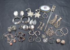 A selection of silver and white metal earrings of various forms, etc