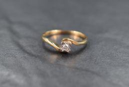 A 9ct gold diamond solitaire, the round cut diamond measuring approximately 0.07ct, in a square
