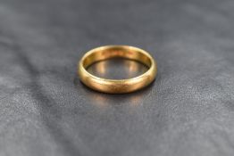 A 22ct gold wedding band, ring size N, 4.9g