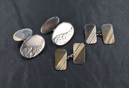 Two pairs of silver cufflinks, one being hand crafted with decorative front oval panels and bar