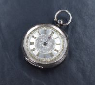 A small silver open face key wound pocket watch, the silver and gold tone dial with Roman