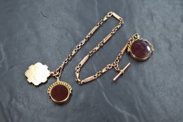 A rose metal decorative linked Albert chain stamped 9C having two blood stone spinning fobs and a