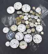A selection of wrist and pocket watch parts, mainly the mechanisms and glasses of various vintages