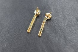 A pair of 9ct gold diamond drop earrings, the rectangular articulated drops with round cut
