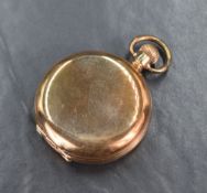 A gold plated Hunter pocket watch having Roman numeral dial with subsidiary seconds on a white
