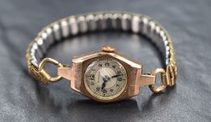 A 9ct gold Pinnacle wristwatch, the white dial having Arabic numerals, on a gold plated bracelet