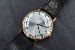 A gent's 1960's 9ct gold Record Deluxe manual wrist watch having Roman numeral dial to silvered face