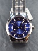 A Tissot 1853 PCR 200 wristwatch, the blue dial having Arabic and baton numerals with date