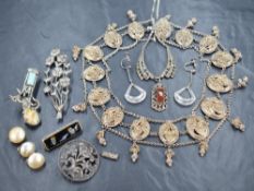 An assortment of silver and white metal jewellery, including a large statement necklace having