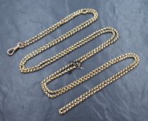 A yellow metal muff chain, with dog clip, having a plaque marked 9c, approximately 82cm, 38g.