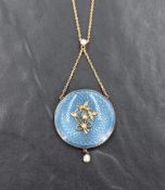 An Edwardian 15ct gold and turquoise enamel locket back pendant of circular form, the turquoise