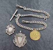 A silver Albert chain with attached gilt coin charm and two loose silver shield medalions, approx