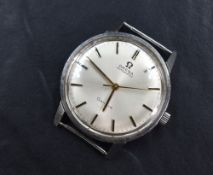 An Omega automatic Geneve wristwatch, the champagne dial having baton numerals in a steel case,