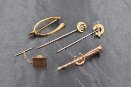 A collection of 18ct and 9ct gold jewellery, comprising three horse related brooches marked 9ct, a