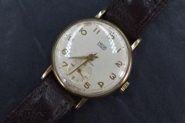 A gent's vintage 9ct gold Smiths Everest wrist watch having Arabic numeral dial with subsidiary