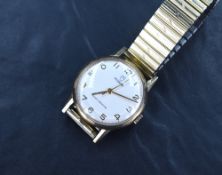 A gent's 1970's vintage 9ct gold Tudor wrist watch having Arabic numeral dial on a champagne