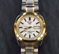 A Seiko 5 7S26 automatic wrist watch having baton numeral dial with date aperture to champagne