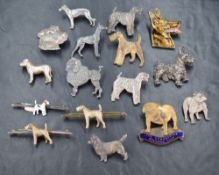 A selection of dog related badges and brooches including silver and KENART
