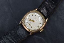 A 9ct gold cased wristwatch, the champagne dial having Arabic and baton numerals, with subsidiary