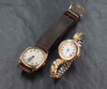 A 9ct gold Rolex wristwatch, the white dial having Roman numerals on a rolled gold bracelet strap,