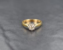 An 18ct gold diamond solitaire ring, approx 0.25ct in an illusionary mount to knife blade shoulders,
