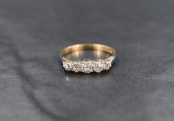 An 18ct gold five stone diamond ring, the graduated diamonds measuring from approximately 0.10ct