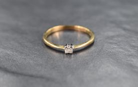 A 9ct gold diamond solitaire ring, the princess cut diamond measuring approximately 0.02ct in a four