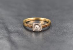 An 18ct gold diamond solitaire ring, the illusion set round cut diamond measuring approximately 0.