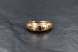 A 9ct gold sapphire and diamond set gypsy ring, ring size N and approximately 3.8g