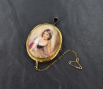 A yellow metal porcelain cameo brooch, depicting a maiden with safety chain, 9g
