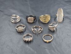 A selection of white metal rings, most stamped silver, of various forms including hematite and '3