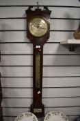 An early 19th Century mahogany cased barometer, by D.Fagioli & Sons, the case surmounted with a swa
