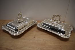 A pair of late 19th/20th Century silver plated and lidded entree dishes of Regency style, each