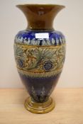 A large Royal Doulton Stoneware vase, decorated with a band of acanthus scrolls and flowerheads,
