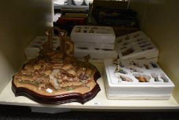 A festive Hawthorne Village Nativity set and stand, comprising numerous painted figures