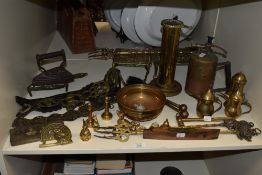 An assorted selection of brassware, to include horse brasses, trivets, fire irons, and a sprayer