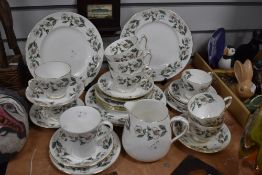 A part Crown Staffordshire fine bone china teaset, decorated with dog rose design and comprising