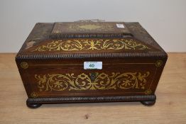 An early 19th Century Regency rosewood work box of sarcophagus form with scrolling brass inlay,