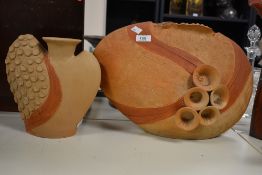 A 20th Century African studio art clay vase, having applied funnel shaped decoration and crimped