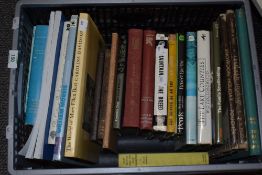 An assorted collection of reading material, titles including 'The Cottage Book', 'The World of