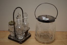 An Edwardian cut glass biscuit barrel with white metal lid and handle, measuring 25cm high, and a