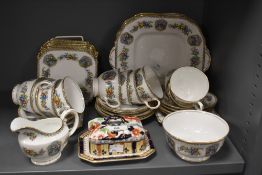 An Aynsley tea set in the 'Edena' pattern and comprising teacups, saucers, cream jug, and sucrier,