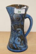 C.H. Brannam, an attractive Arts & Crafts fish jug covered in a blue and green glaze, having incised