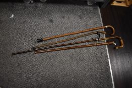 A bundle of walking sticks, including a shepherd's crook measuring 128cm high
