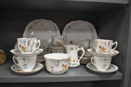 An early 20th Century Salisbury china tea set in the Tulip pattern, comprising teacups, saucers,