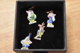 A selection of four early 20th Century miniature enamelled pendants depicting four of the Seven