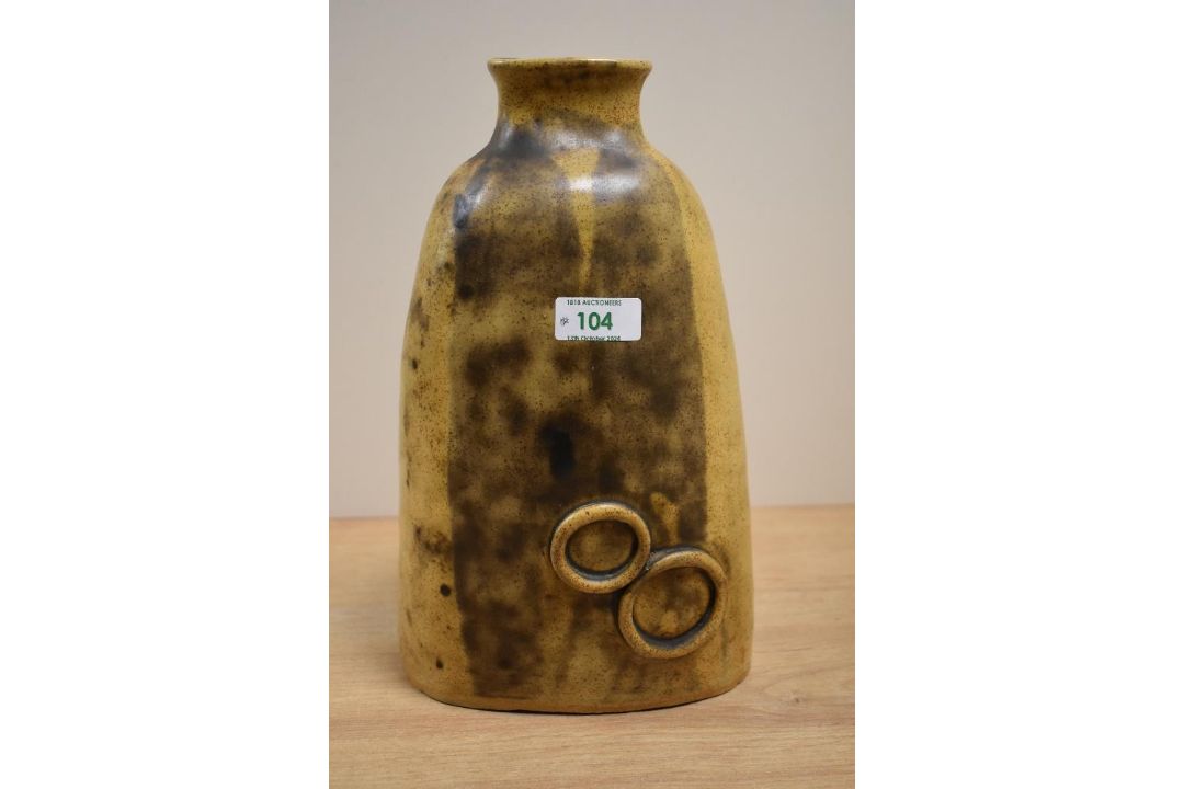 A 1970s stoneware vase, of bell form and in the Bernard Rooke style, measuring 30cm high